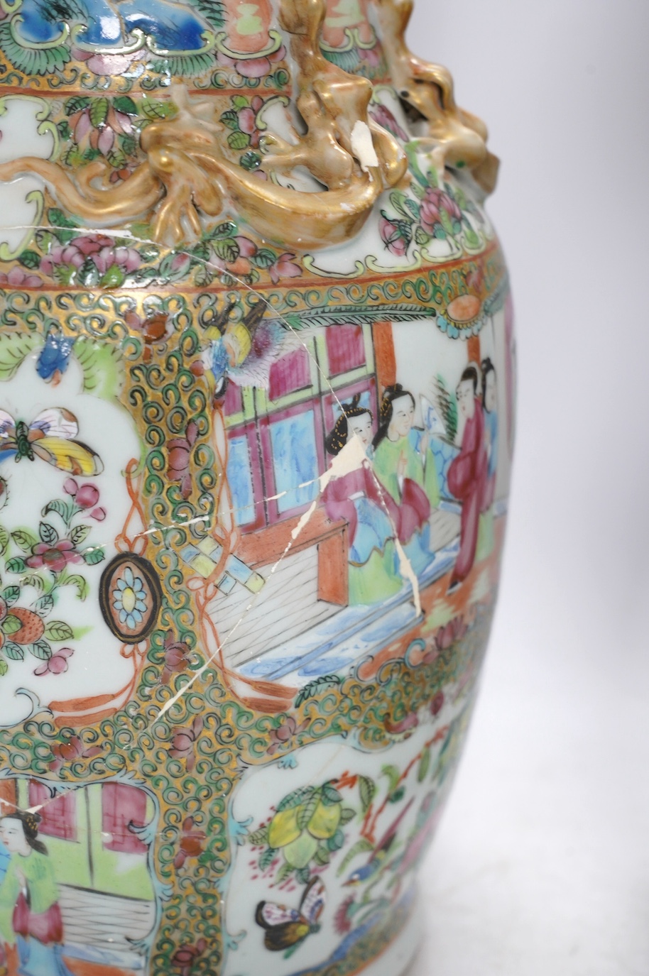 A pair of 19th century Chinese Canton famille rose vases, 36cm high. Condition - poor